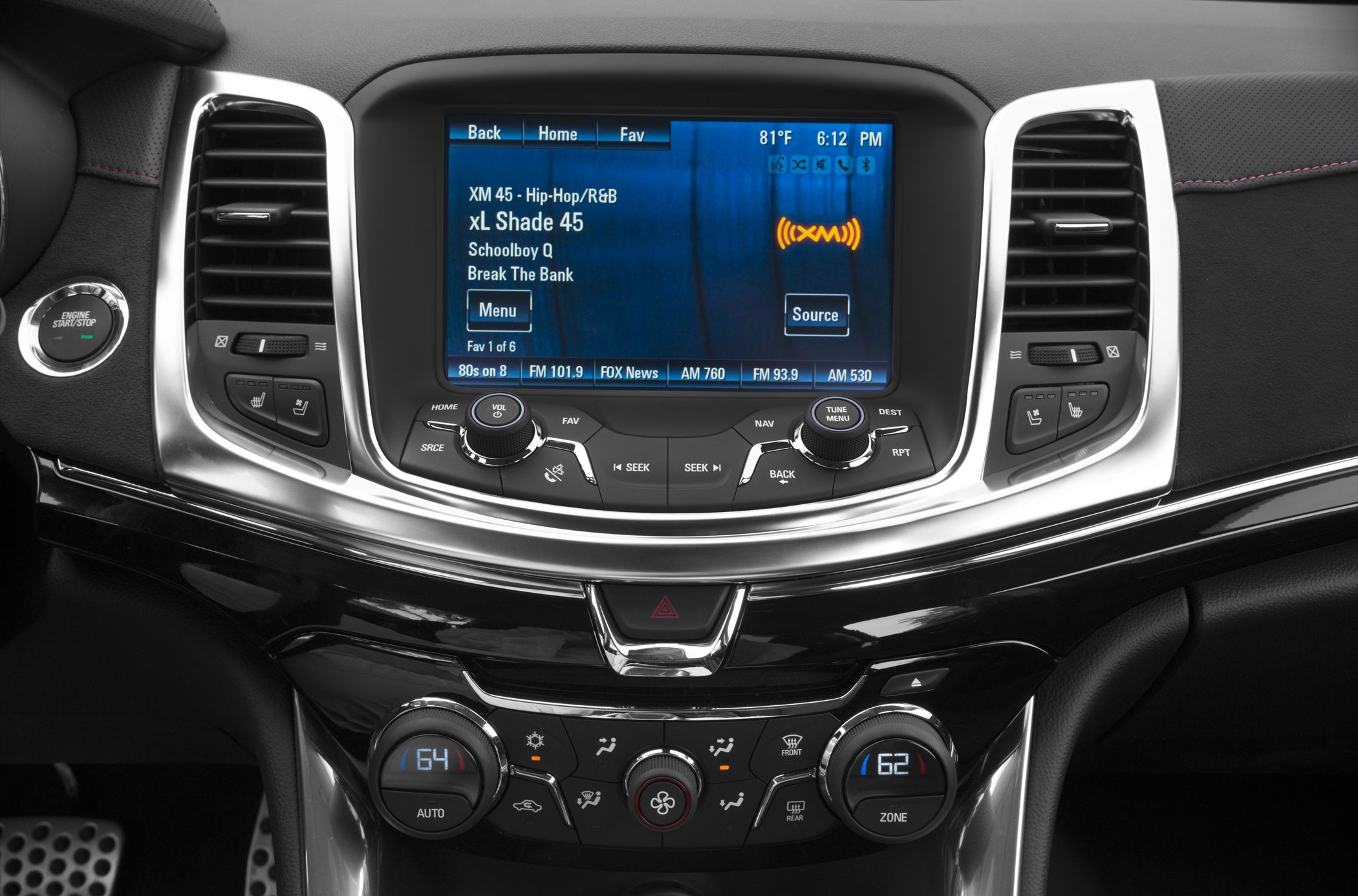 Infotainment screen and climate controls with dual-zone temperature display.