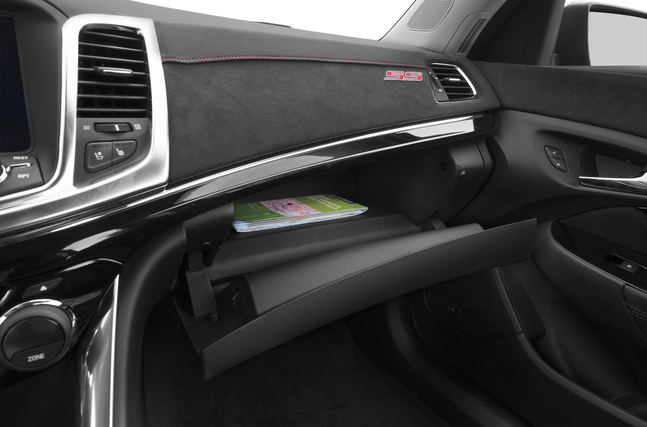 Dashboard and open glove compartment with visible SS badge and controls