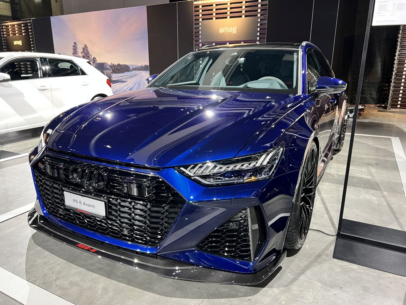 Close-up on front grille and LED headlight design with sporty aero features.