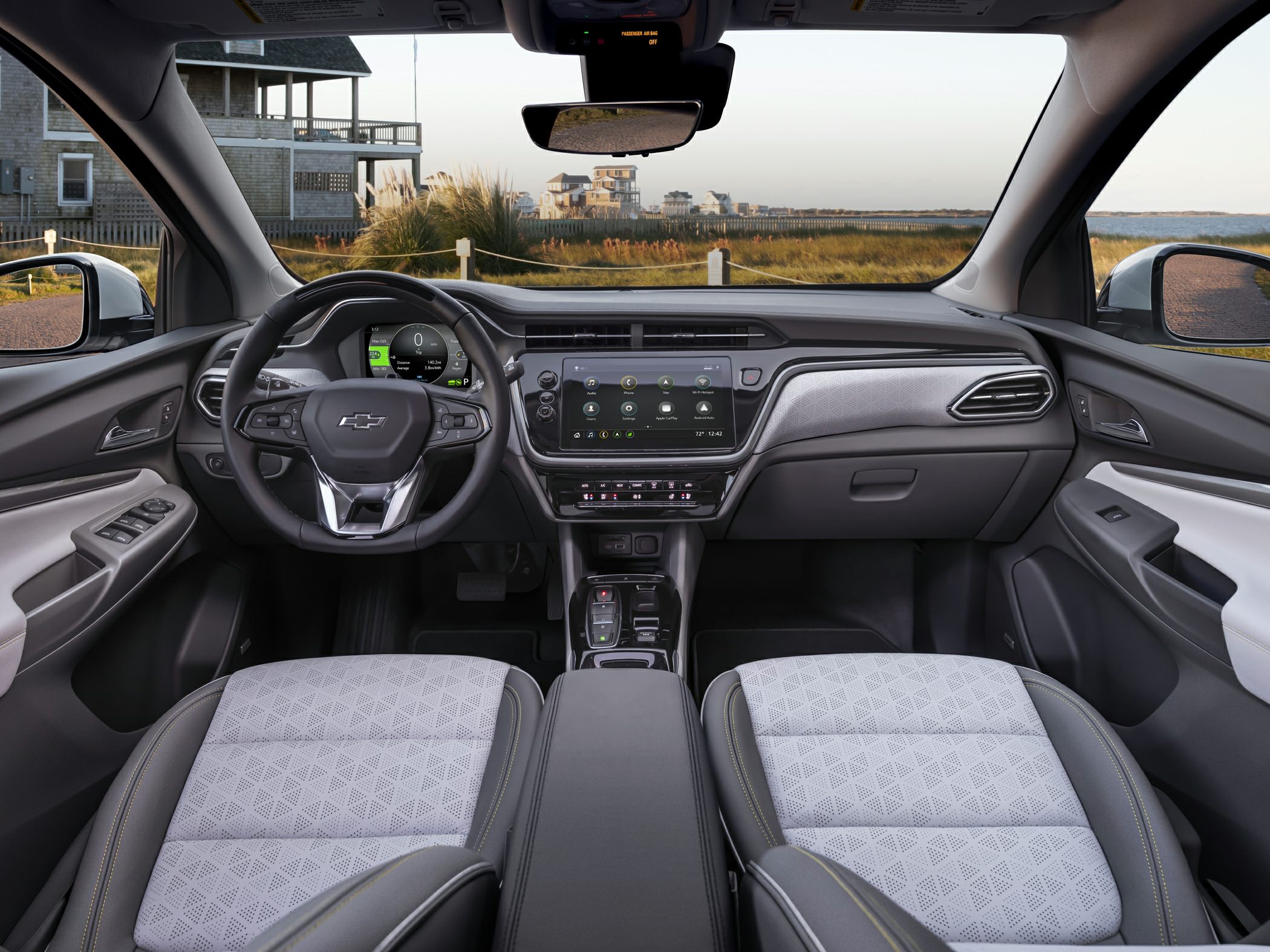 Digital instrument cluster and touchscreen infotainment in modern electric car cabin