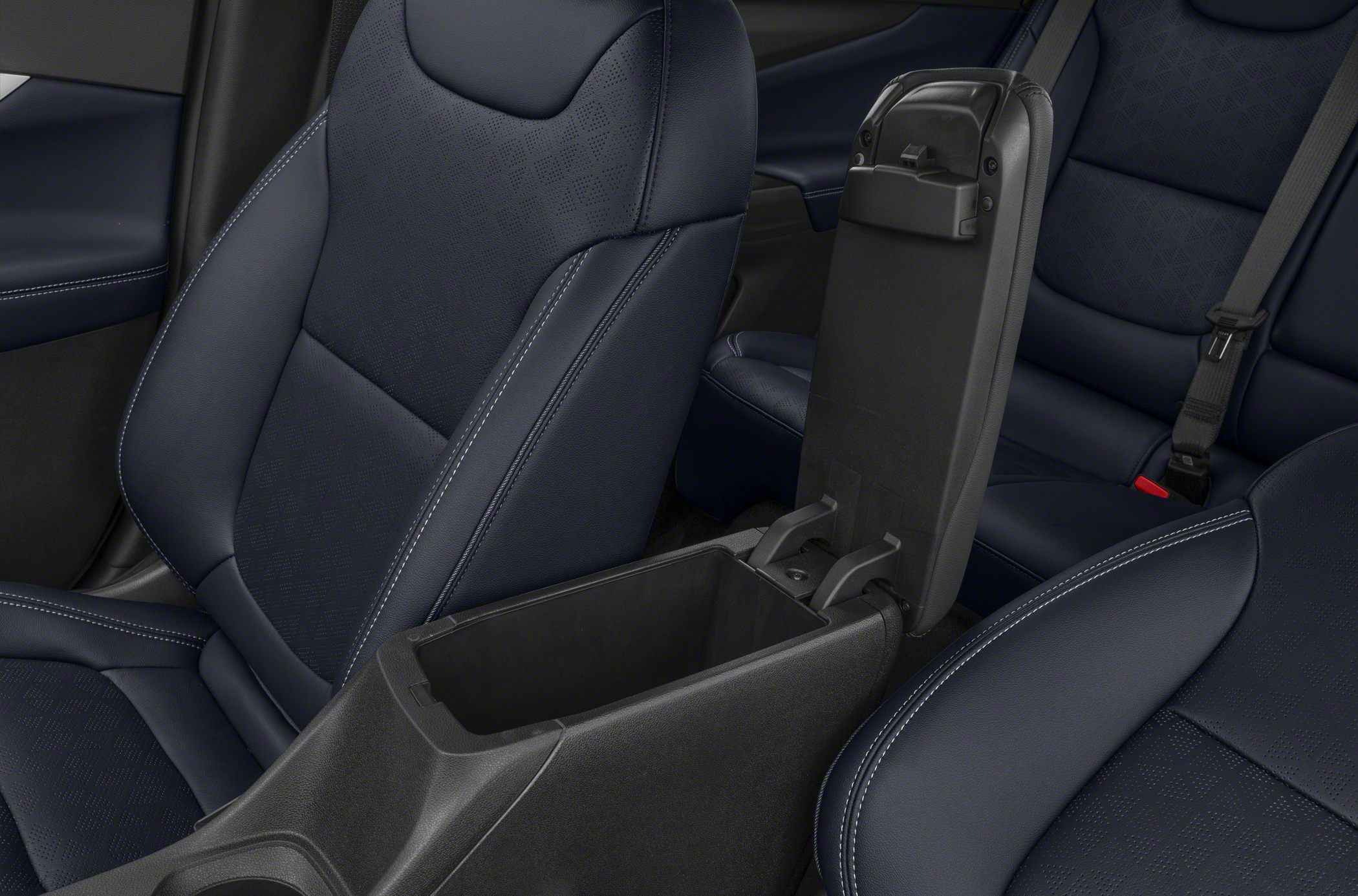 Center console storage compartment and leather seats with stitching