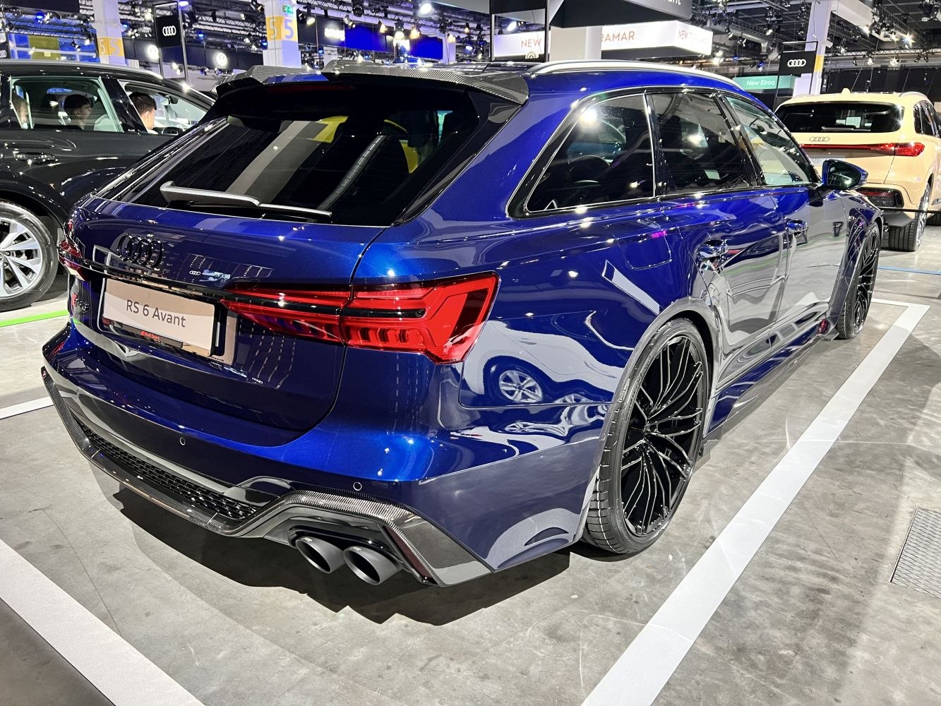 Rear view of a sporty wagon with quad exhausts and distinctive tail lights