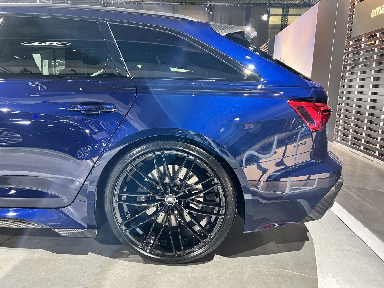 Rear side with black ABT multi-spoke alloy wheel and distinctive tail light.