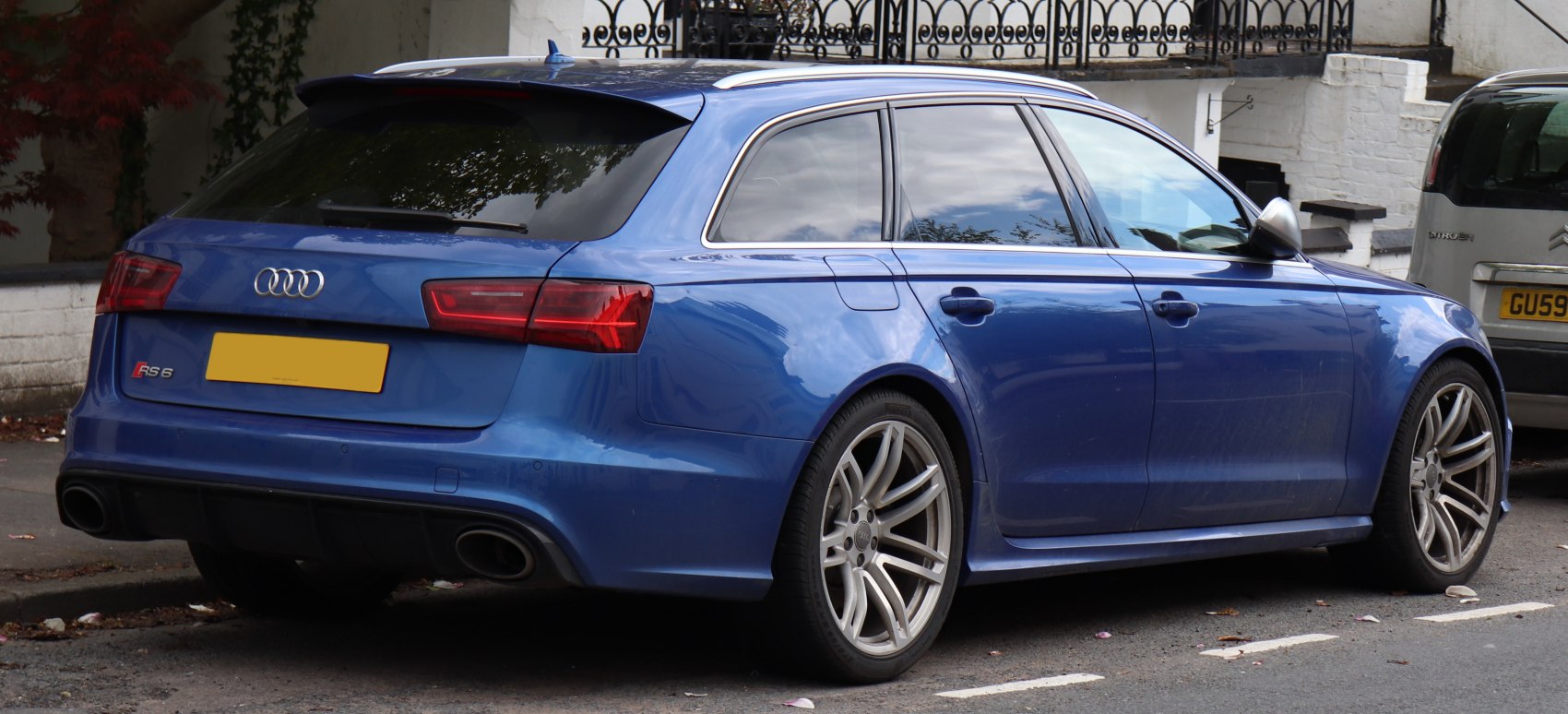 Rear-side view with quad exhausts and alloy wheels