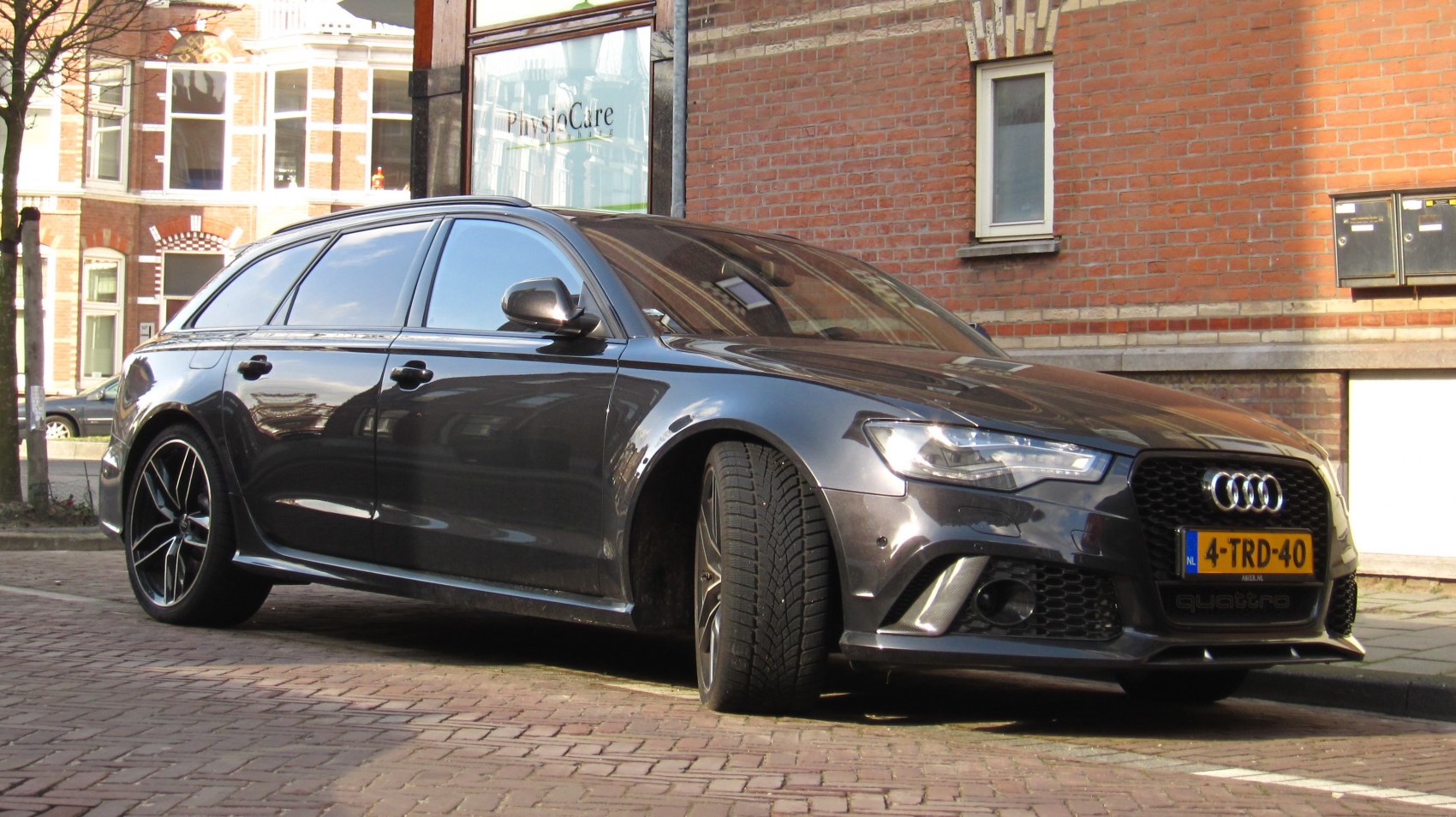Sporty black high-performance wagon with aggressive grille and sleek design