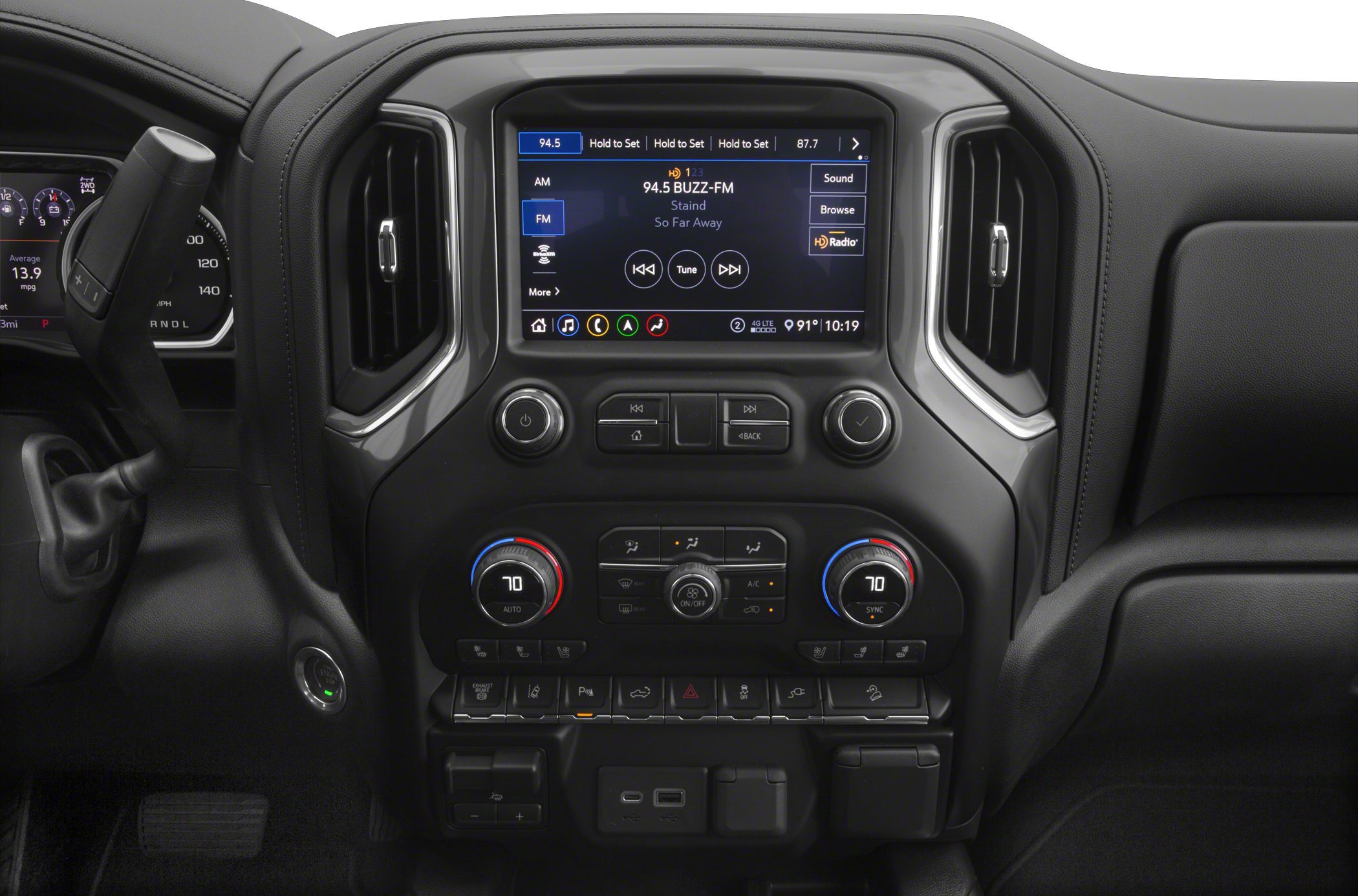 Dashboard with touchscreen infotainment, dual-zone climate controls, gear shift lever