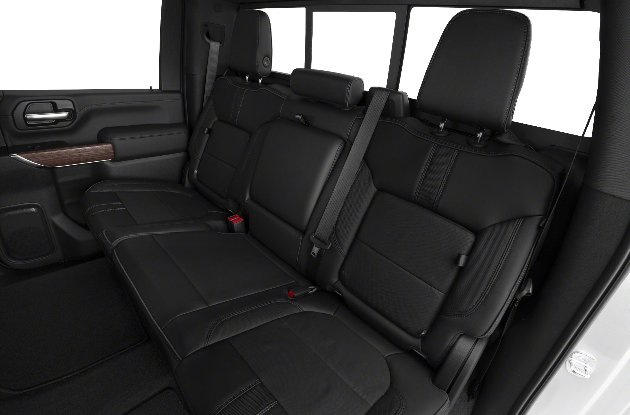 Rear black leather seats with seat belts in truck cabin