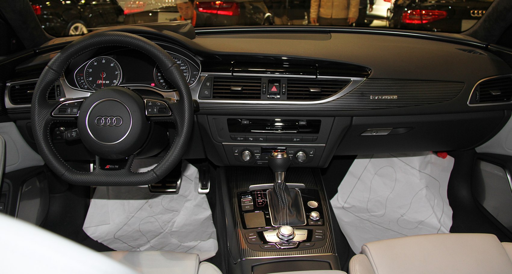 Audi interior with dashboard, multimedia control, and steering wheel
