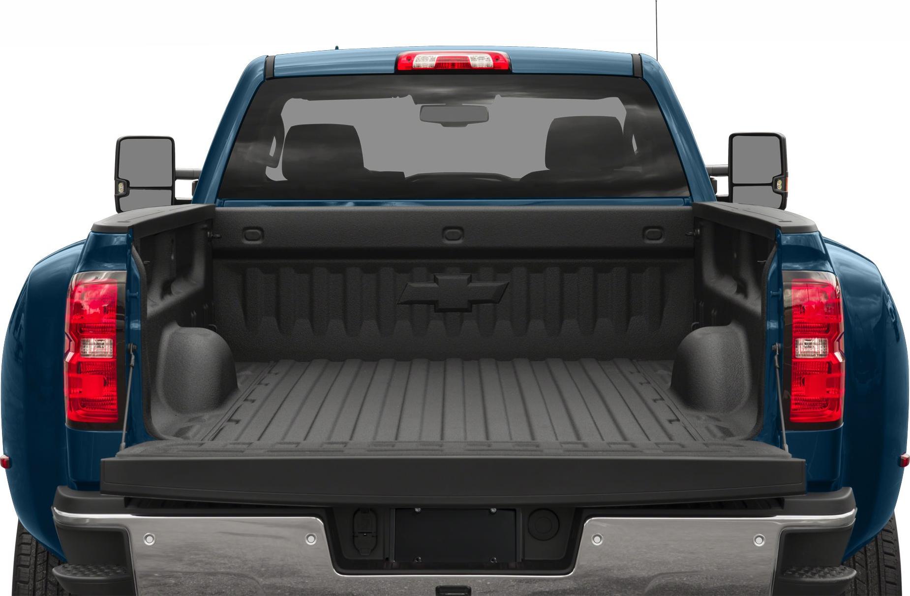 Open long truck bed with tailgate down and extended mirrors