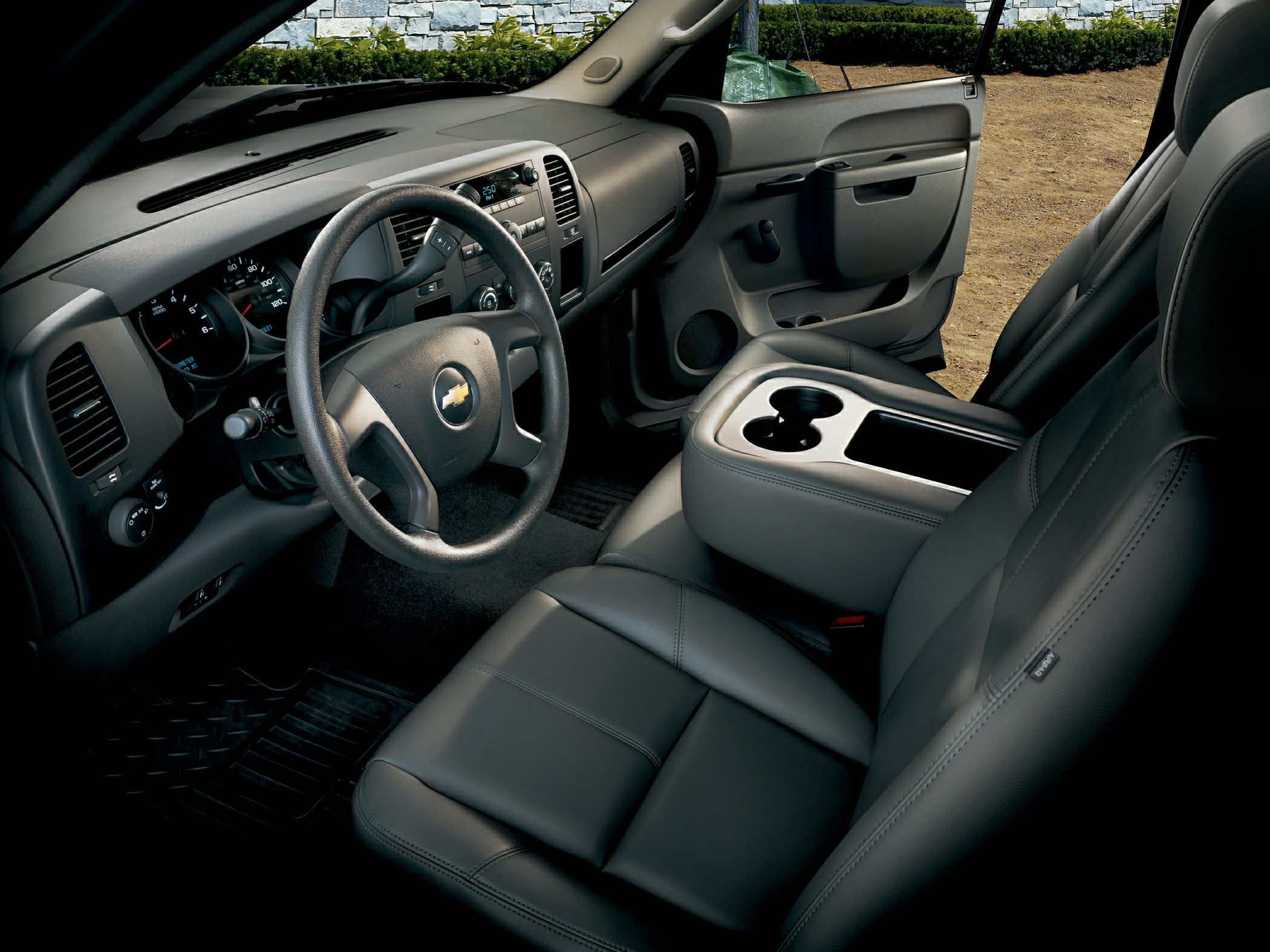 Dashboard, steering wheel, and leather front seats of pickup truck interior