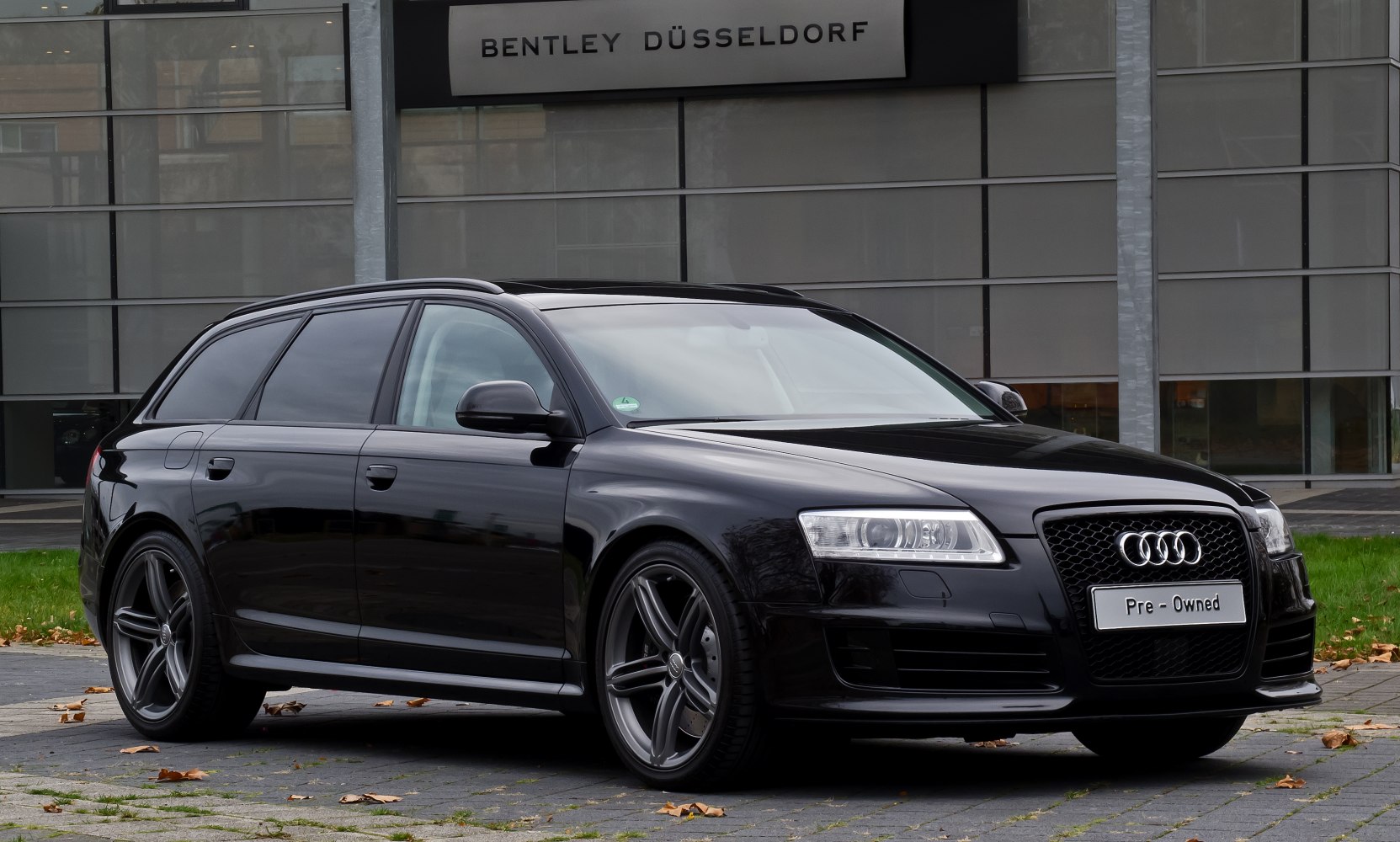 Black sporty station wagon with sleek design and alloy wheels