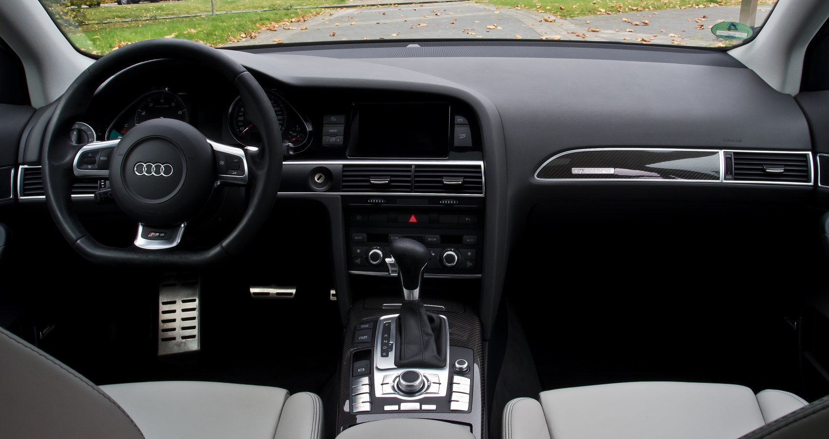 Audi car interior with steering wheel and center console