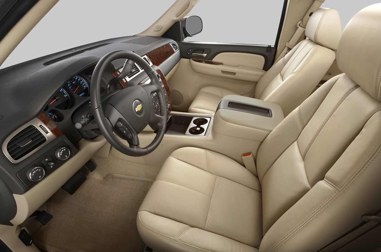 Beige leather seats and wood trim dashboard interior