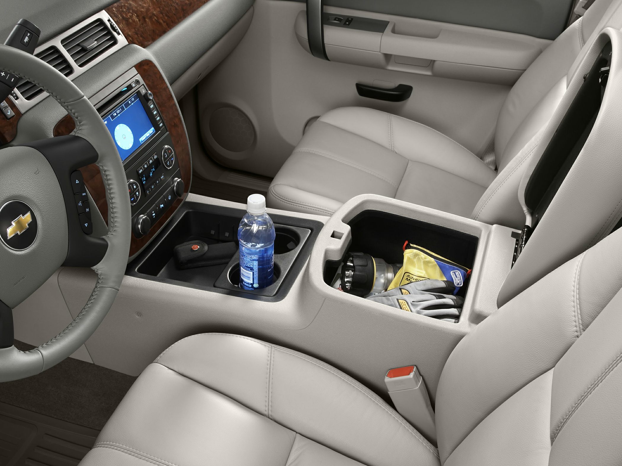 Center console storage and dashboard with leather seats and steering wheel