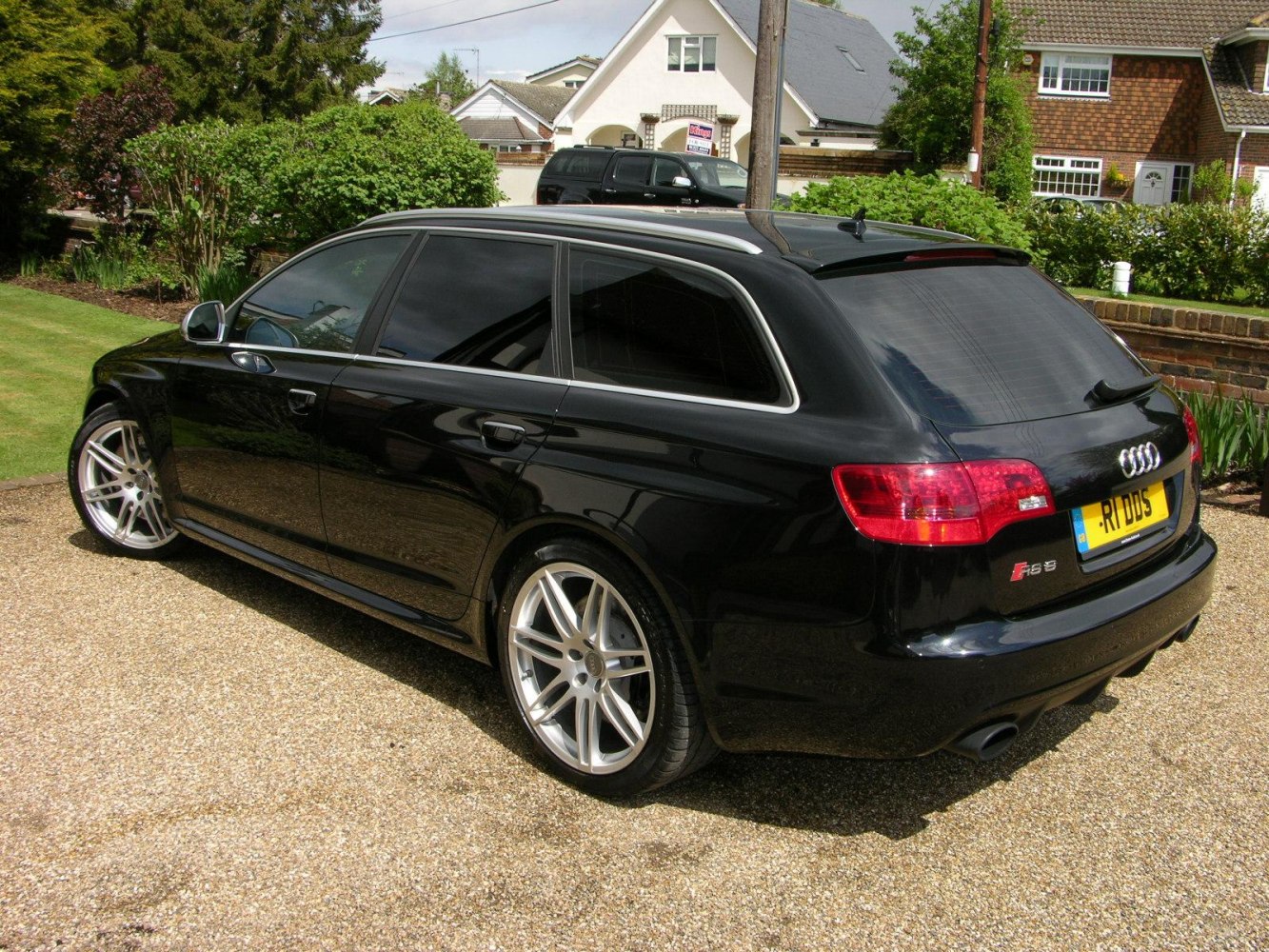 Rear side view with alloy wheels and tinted windows