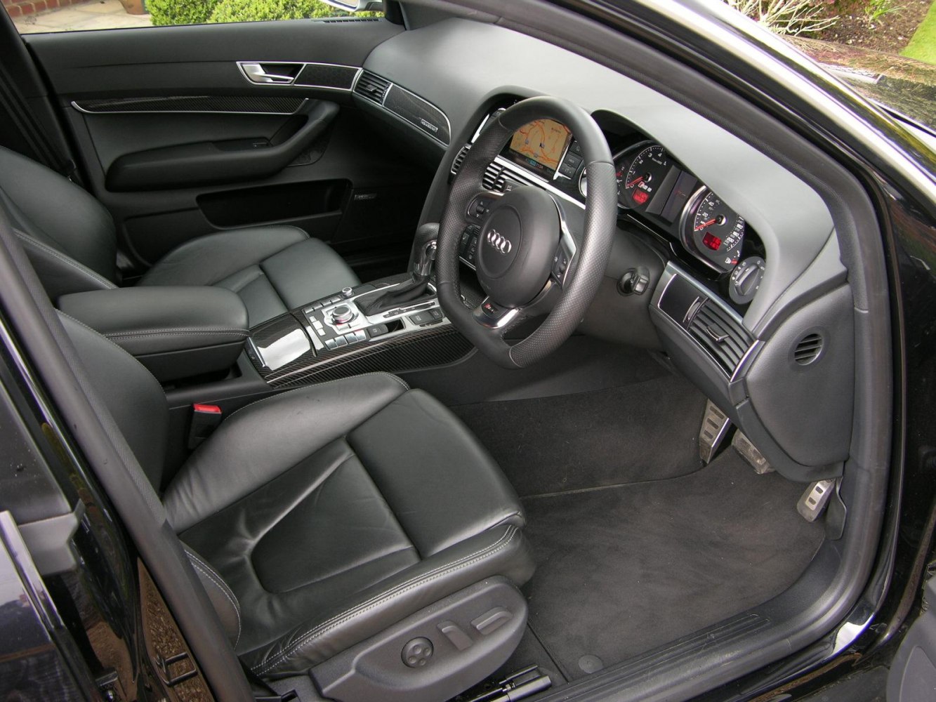 Leather seats, carbon fiber trim, navigation display, sporty steering wheel