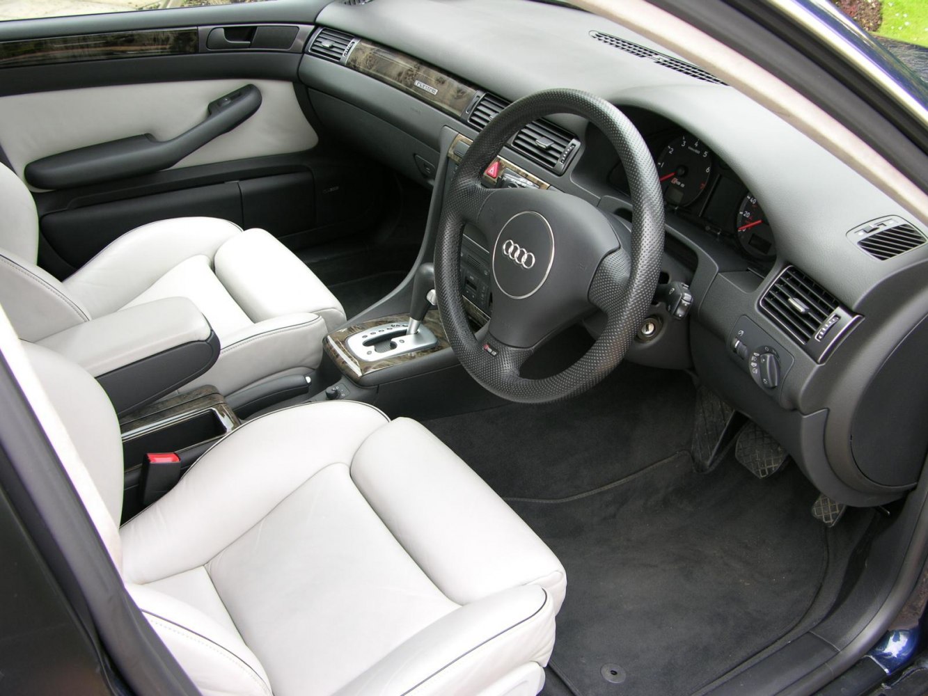 Leather interior with sports seats and detailed dashboard.