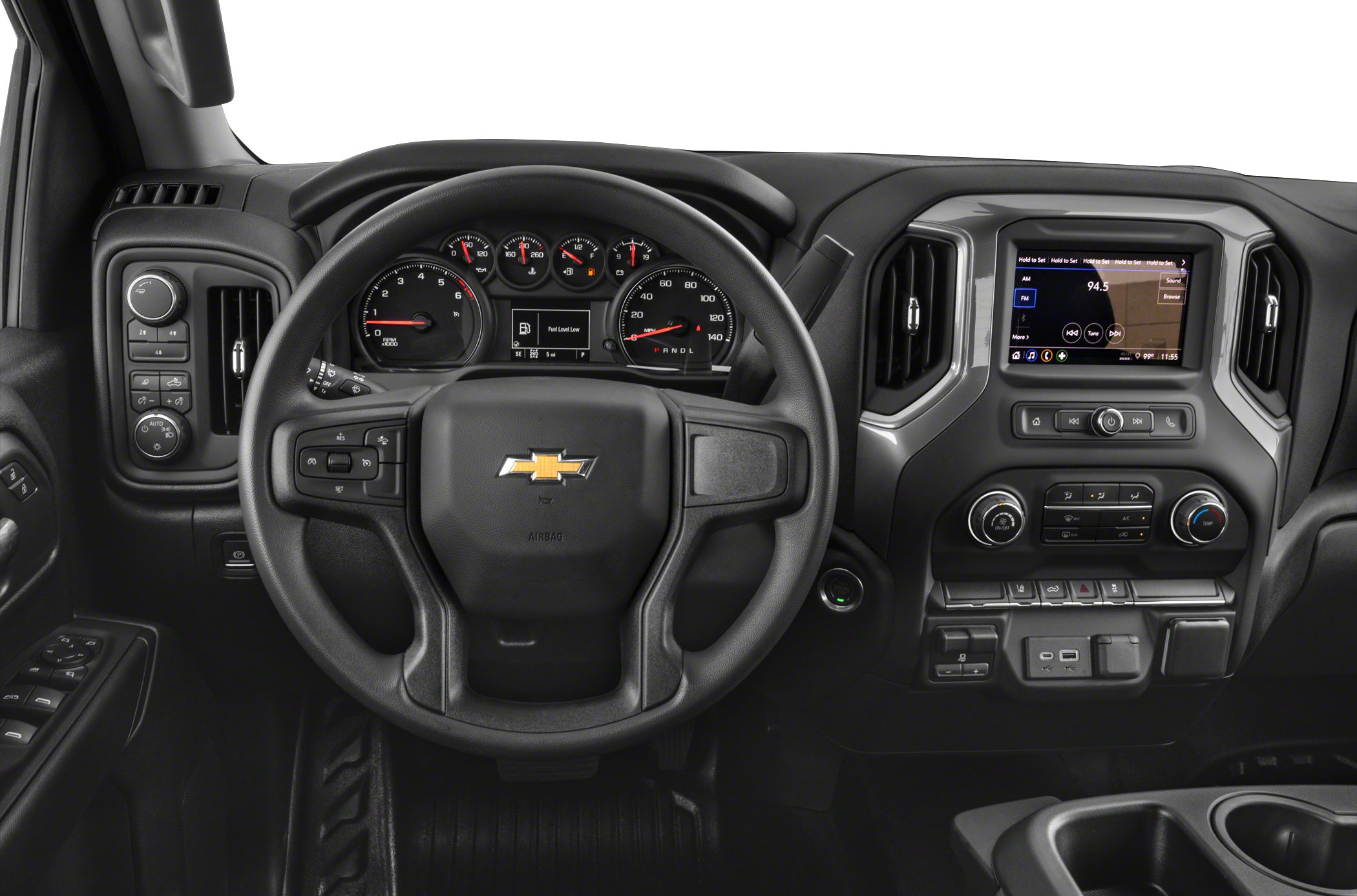 Steering wheel, digital instrument cluster, and central infotainment display in truck interior