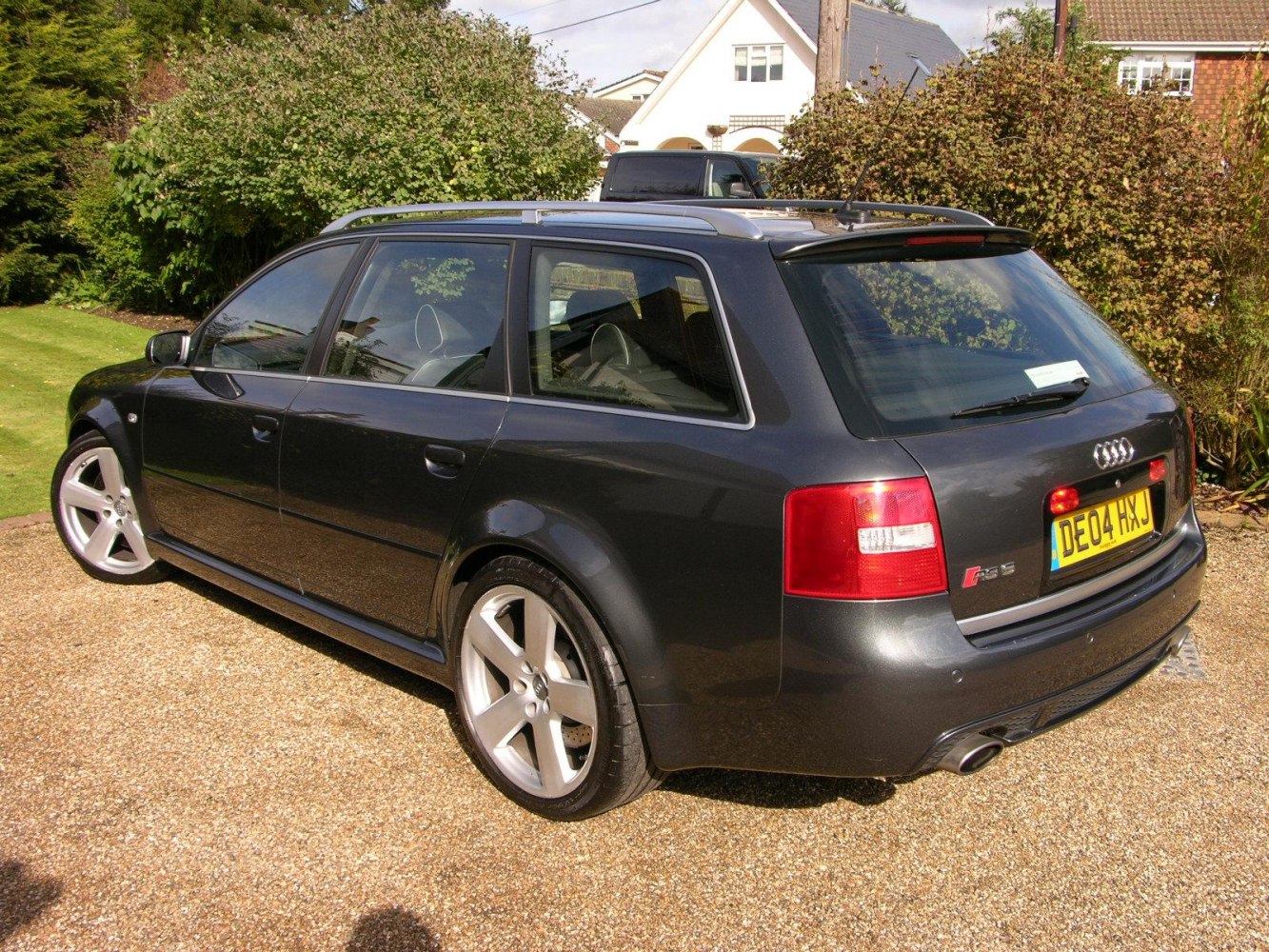 Rear side view of estate car with alloy wheels and roof rails