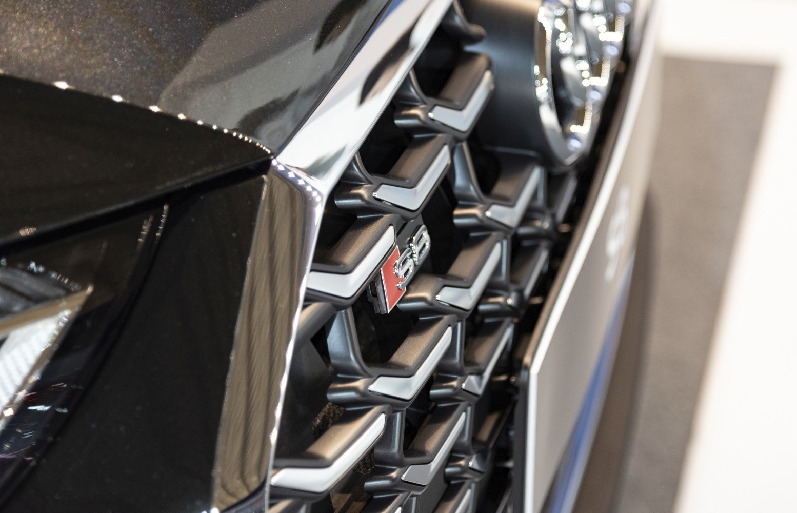 Close-up of honeycomb front grille with S8 badge