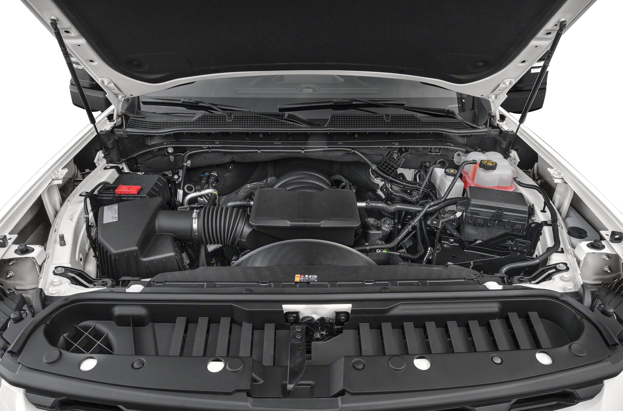 Open engine compartment with visible components and fluid reservoirs