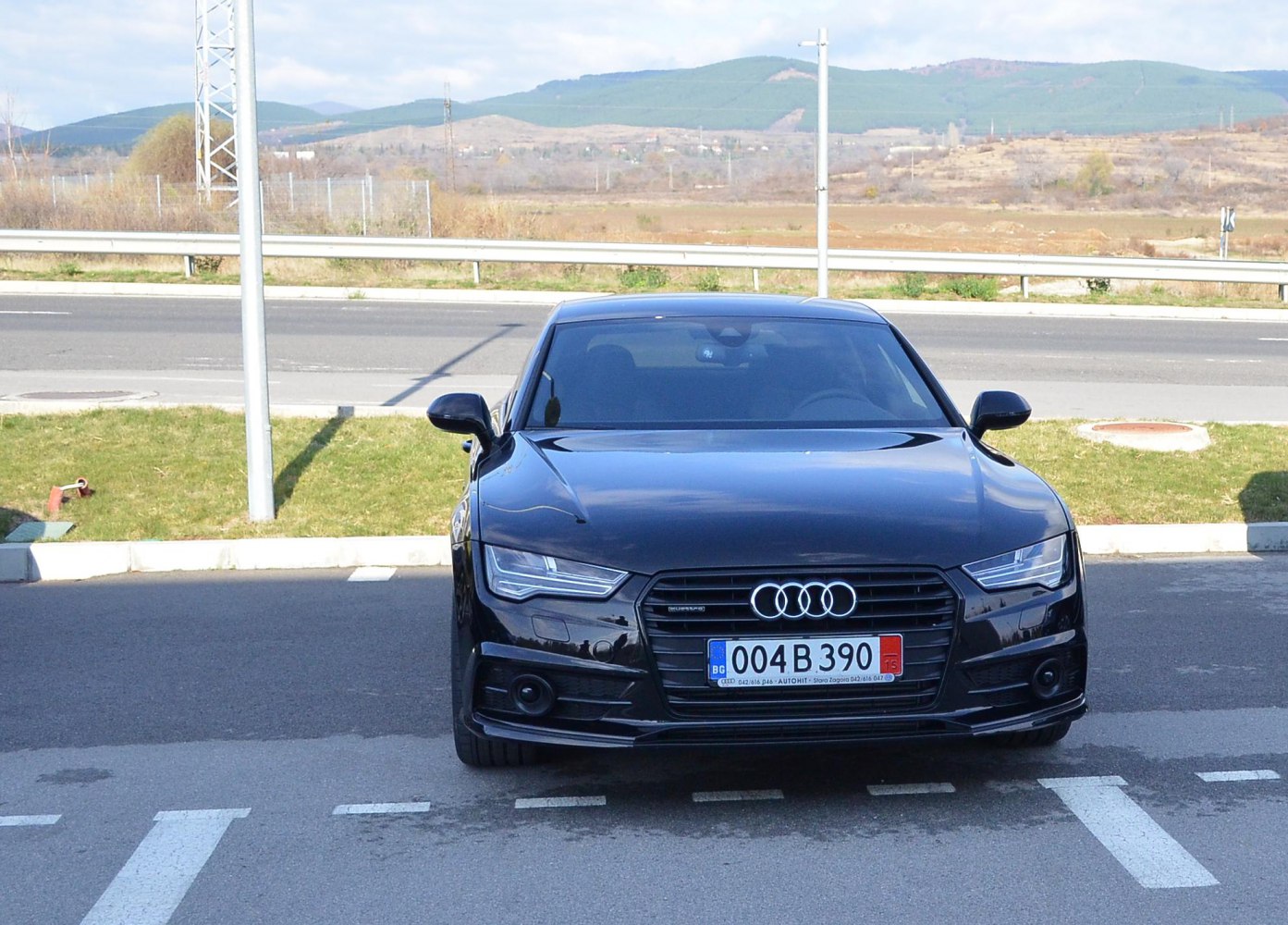 Front view with signature grille and LED headlights