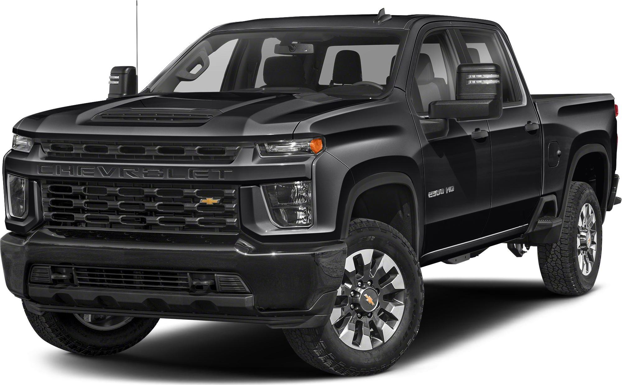 Heavy-duty double cab pickup with bold grille and rugged tires.