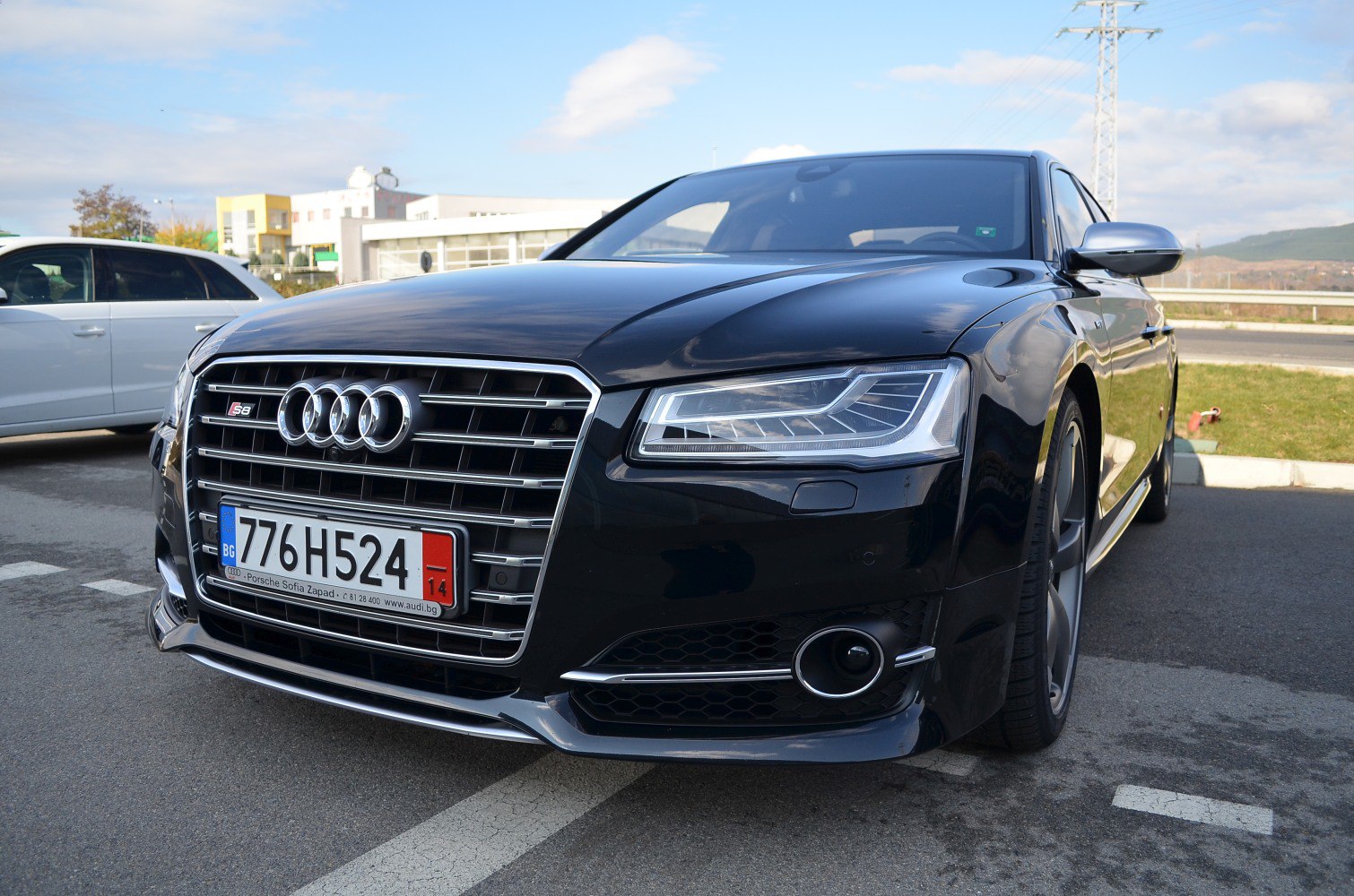 Close-up view of a car's front grille and LED headlight design.