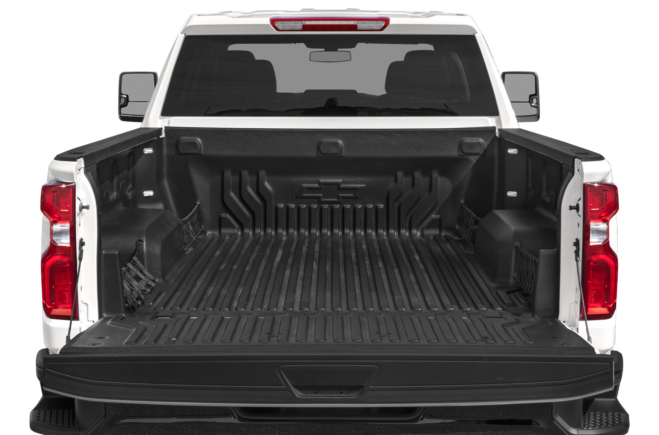 Spacious long bed with protective bed liner and cargo nets.