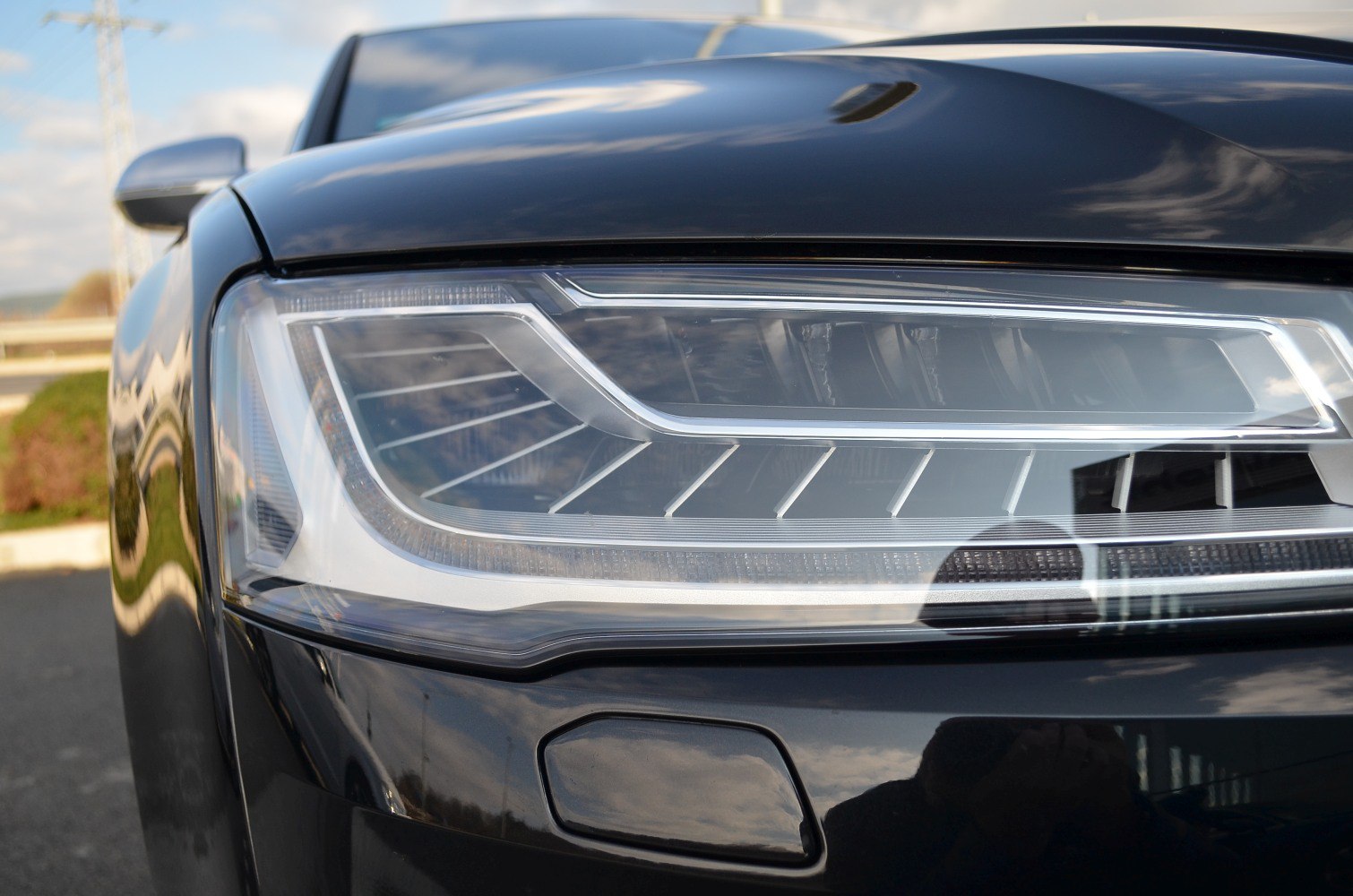 Close-up of modern LED headlight with sharp angular design