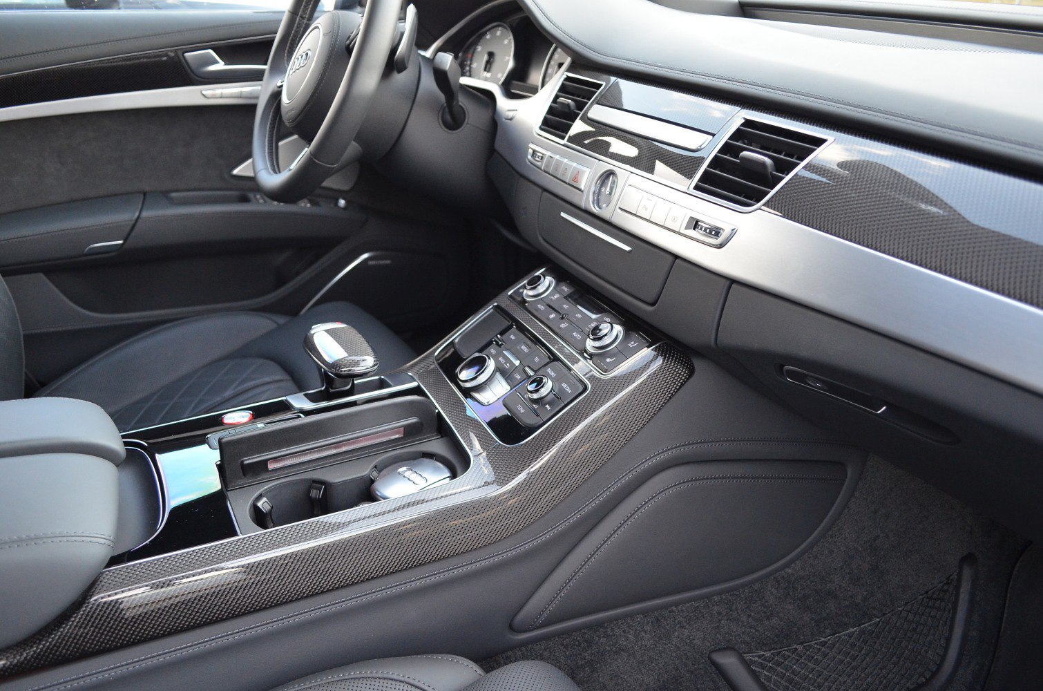 Luxury interior with carbon fiber trim and advanced control dials