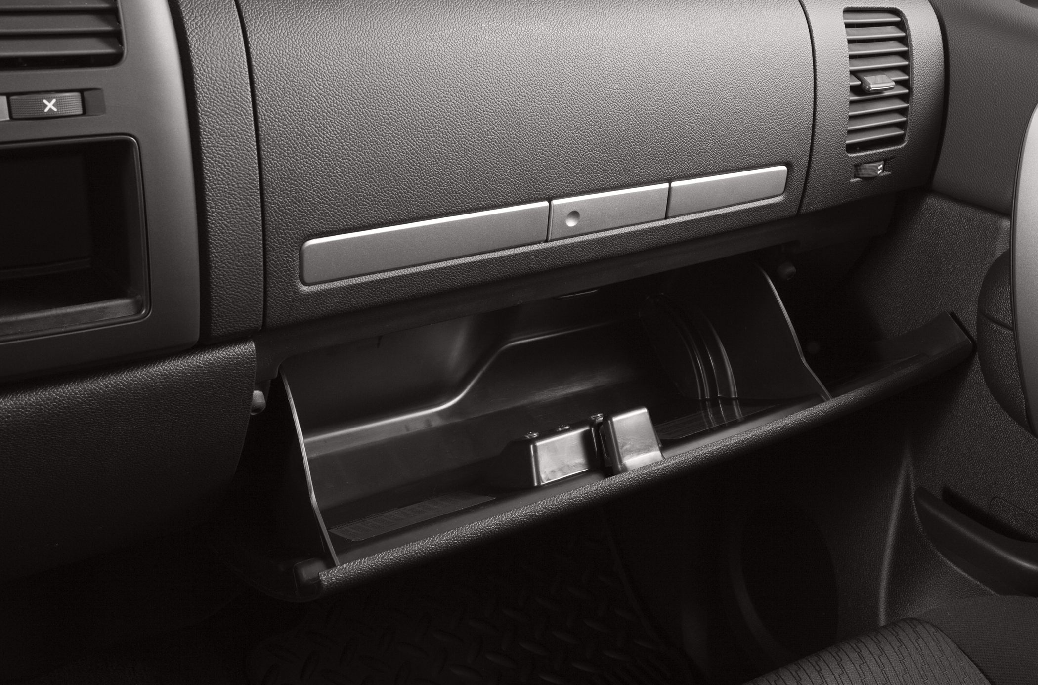 Open glovebox and dashboard layout in vehicle interior
