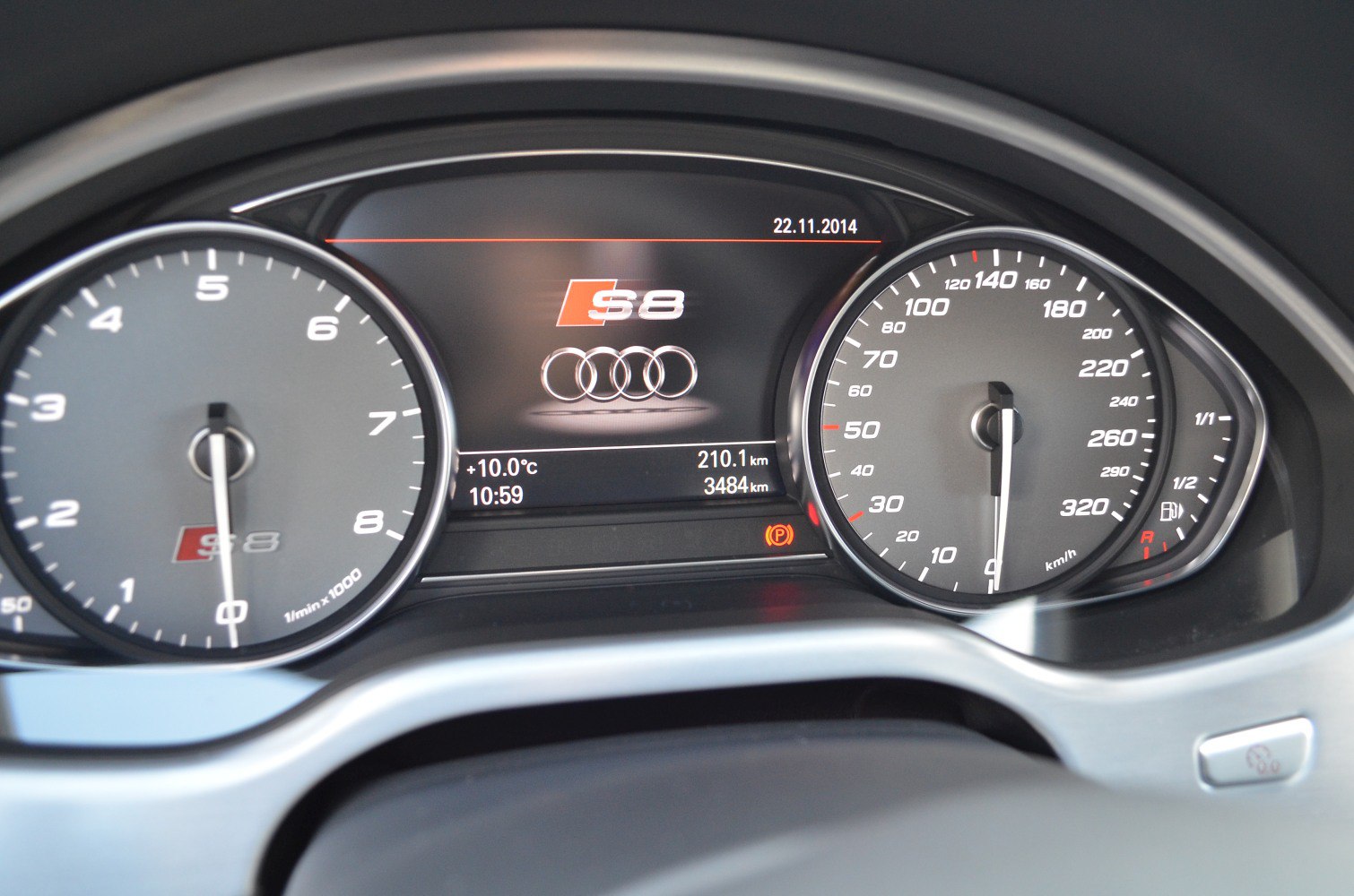 Digital instrument cluster with tachometer and speedometer dials