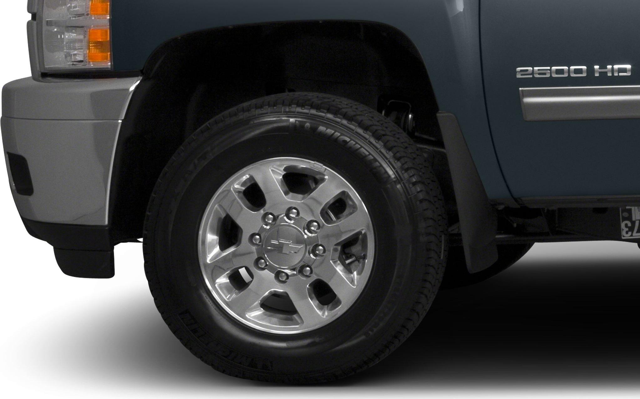 Polished chrome alloy wheel with front fender and side panel details.