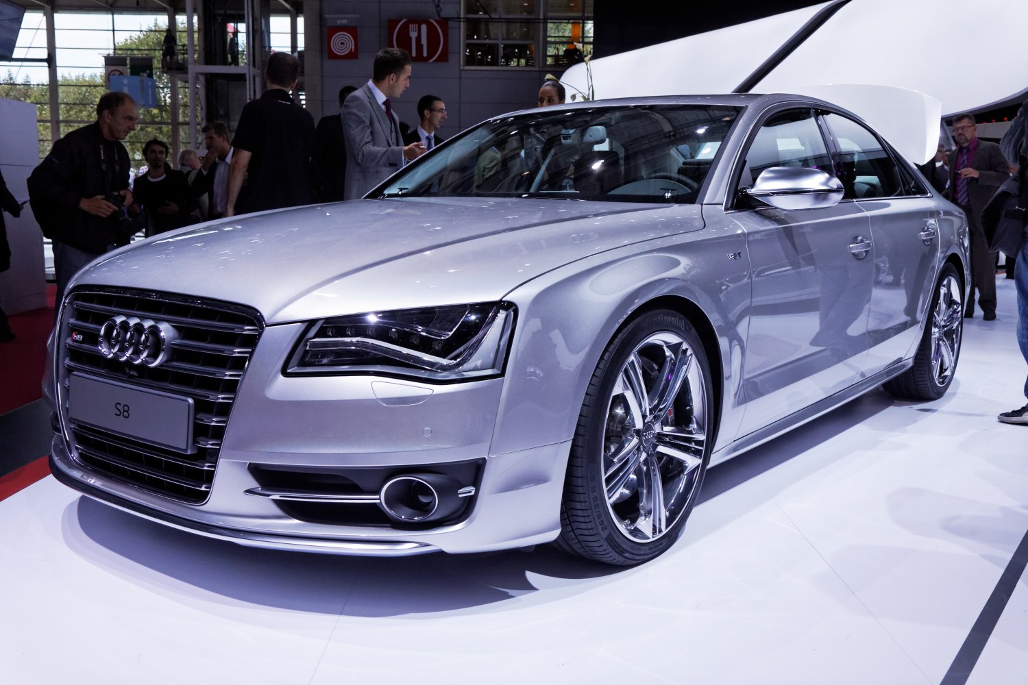 Luxurious silver sedan with LED headlights and chrome wheels.
