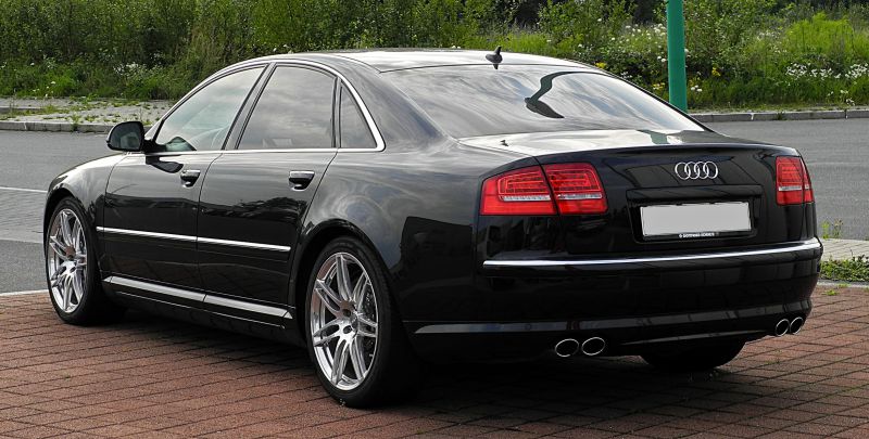 Rear exterior with quad exhausts and alloy wheels