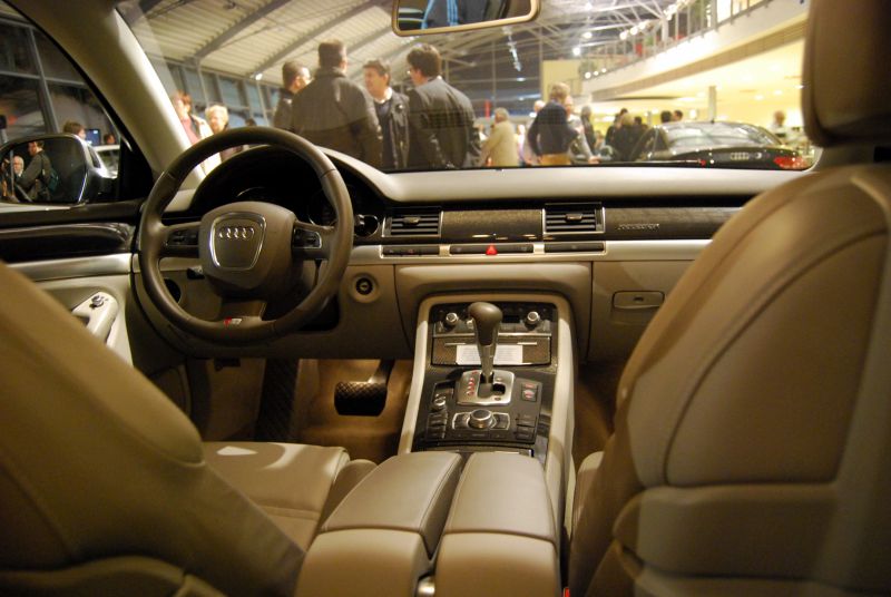 Luxury car interior with steering wheel and gear shift