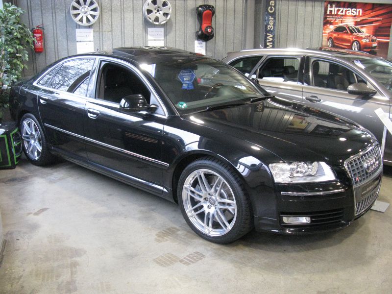 Black luxury sedan with alloy wheels and sleek design