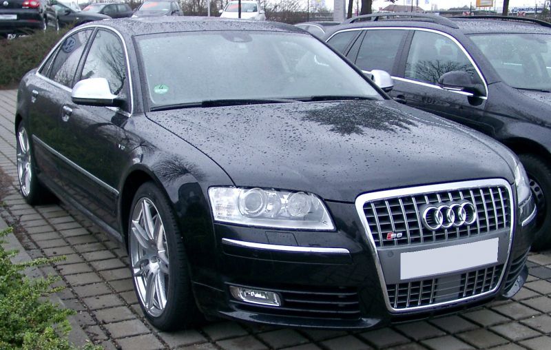 Front view of luxury sedan with signature grille and alloy wheels