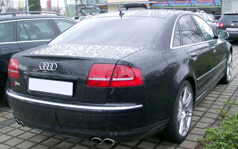 Rear view of sedan with quad exhaust tips and distinct taillights