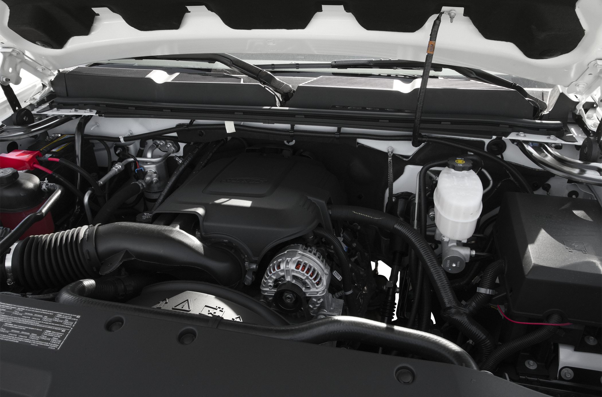 Engine bay layout with air intake and alternator components