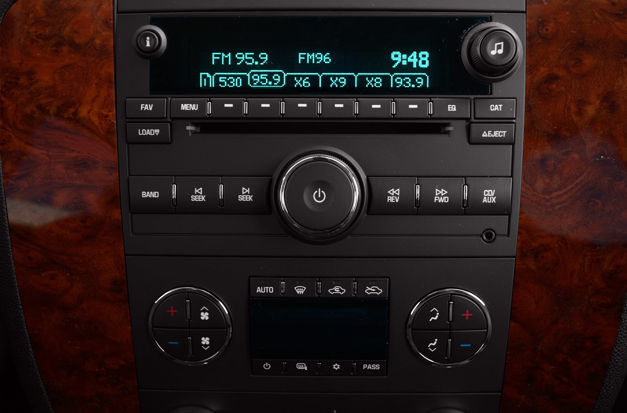 Digital radio and climate control panel with wood grain trim