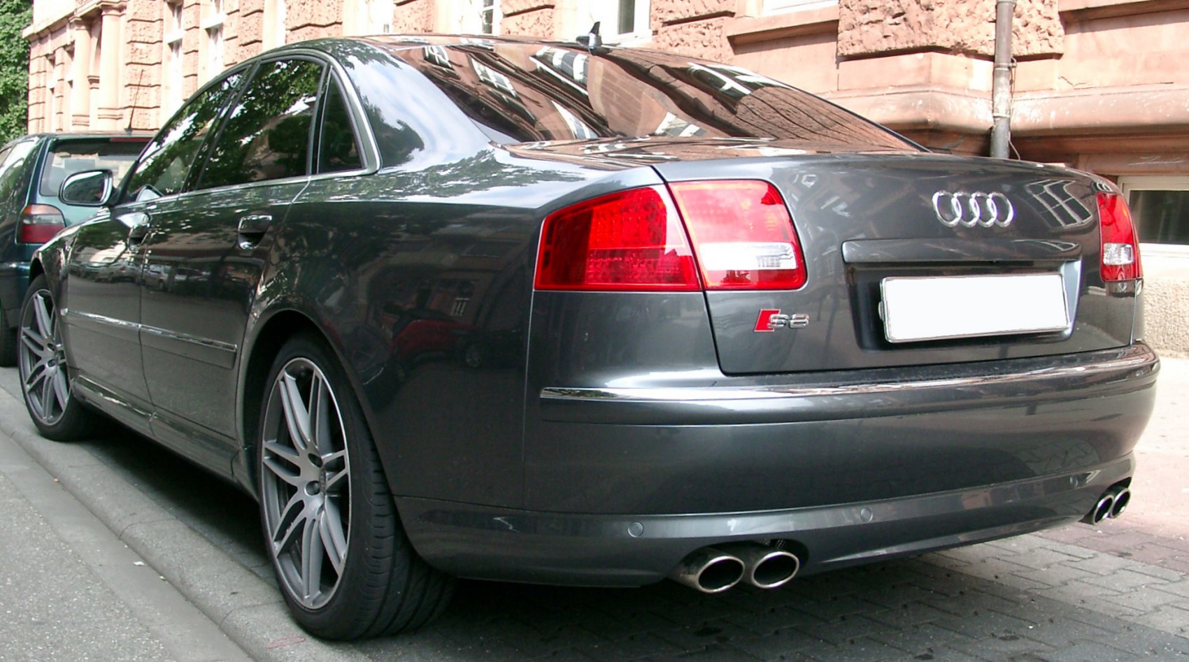 Rear view with quad exhausts and multi-spoke alloy wheels