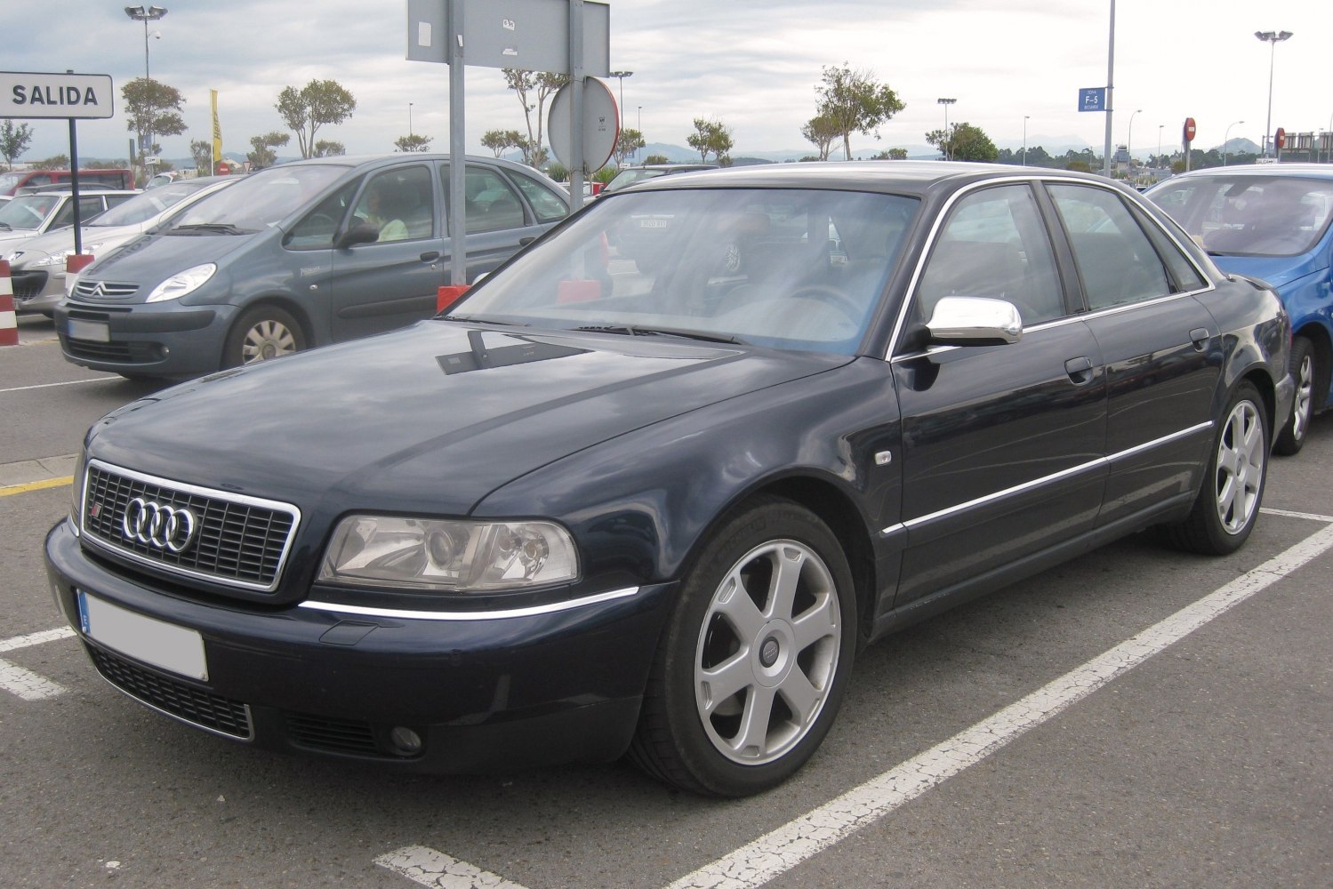 Luxury sedan with alloy wheels and chrome mirror caps