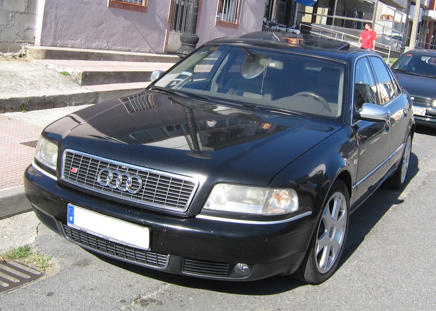 Front angle with chrome side mirrors and grille with Audi rings emblem