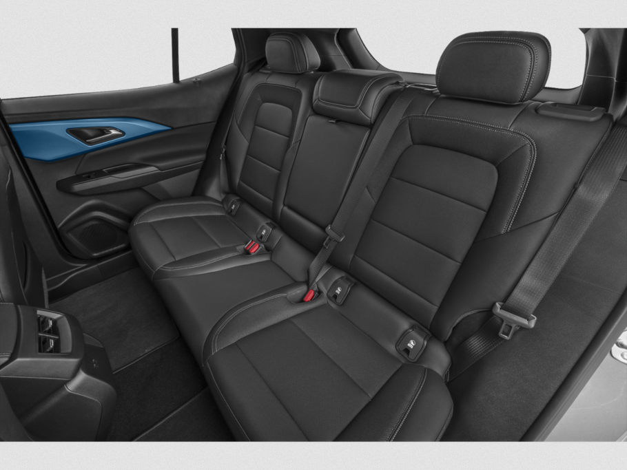 Spacious rear seat with black leather upholstery and modern design.