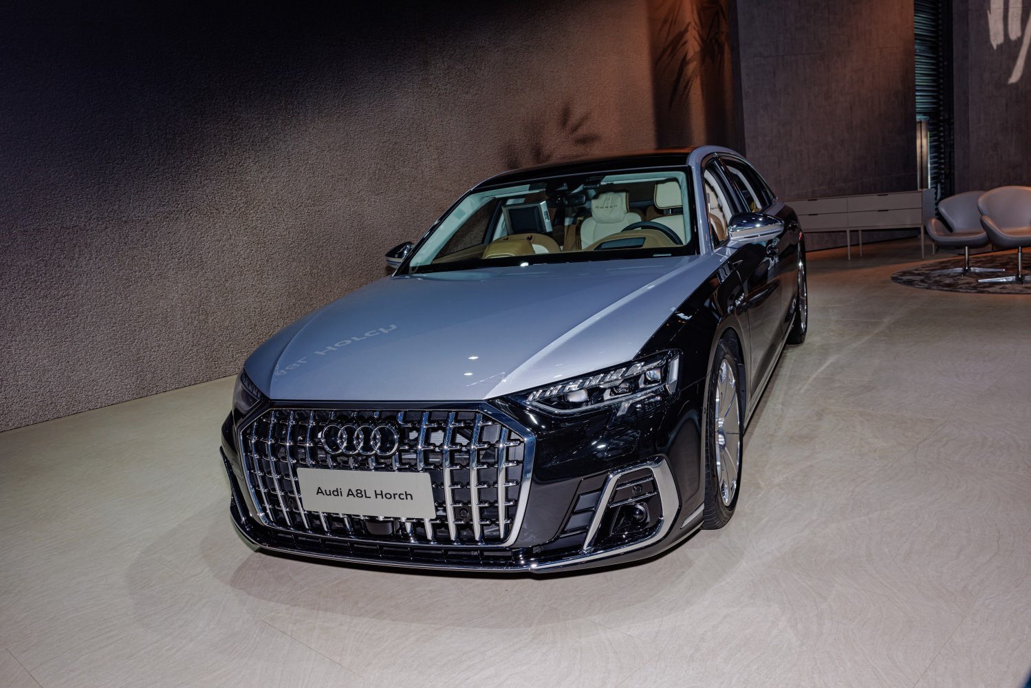 Luxury sedan front grille and LED headlights with elegant design.