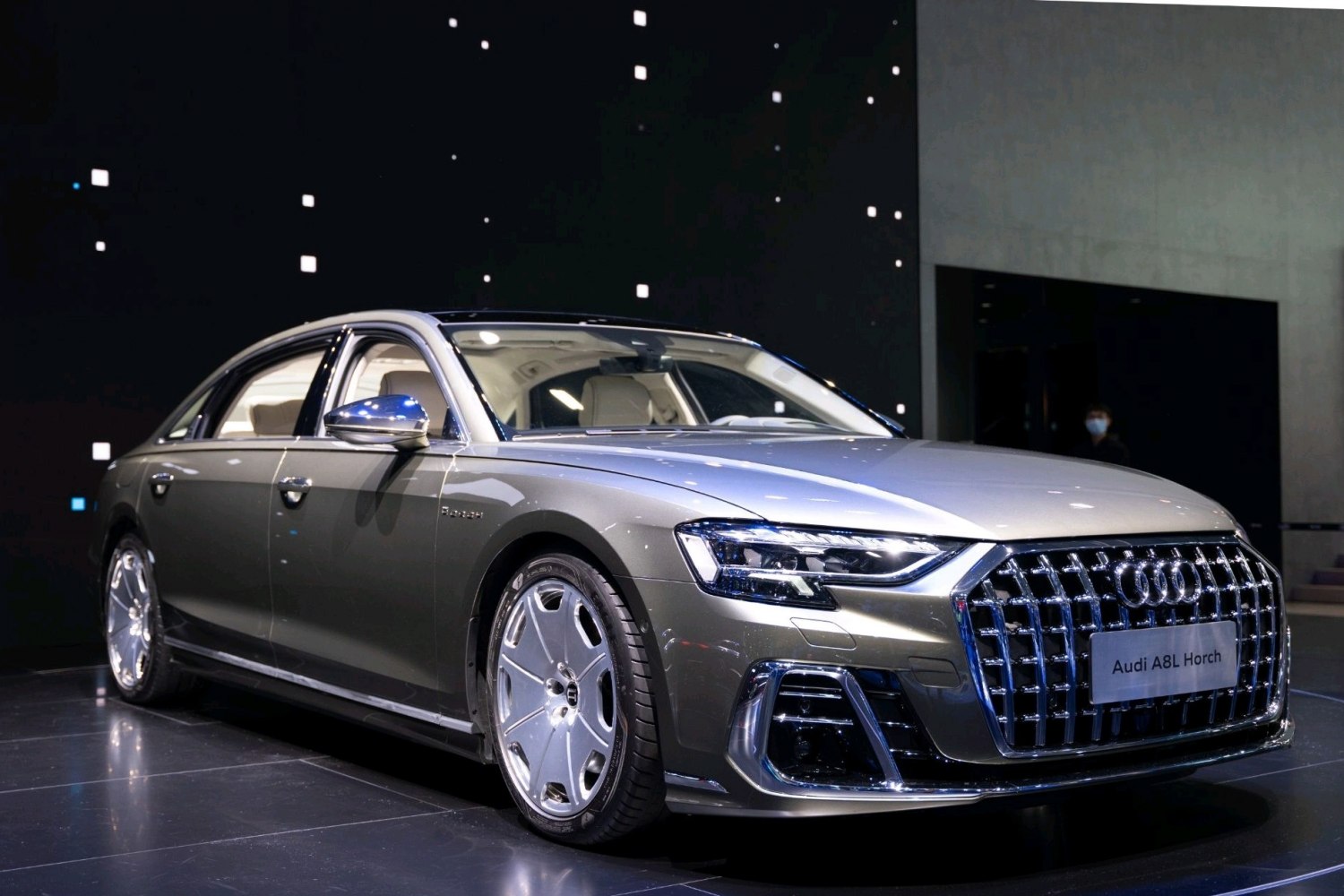 Luxury sedan with large chrome grille and stylish alloy wheels