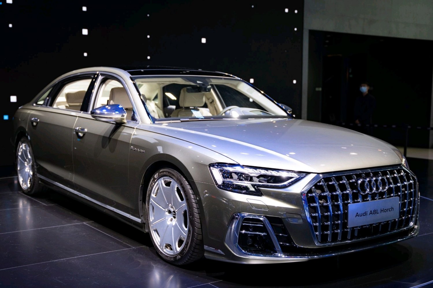 Luxury sedan with large chrome grille and sleek LED headlights