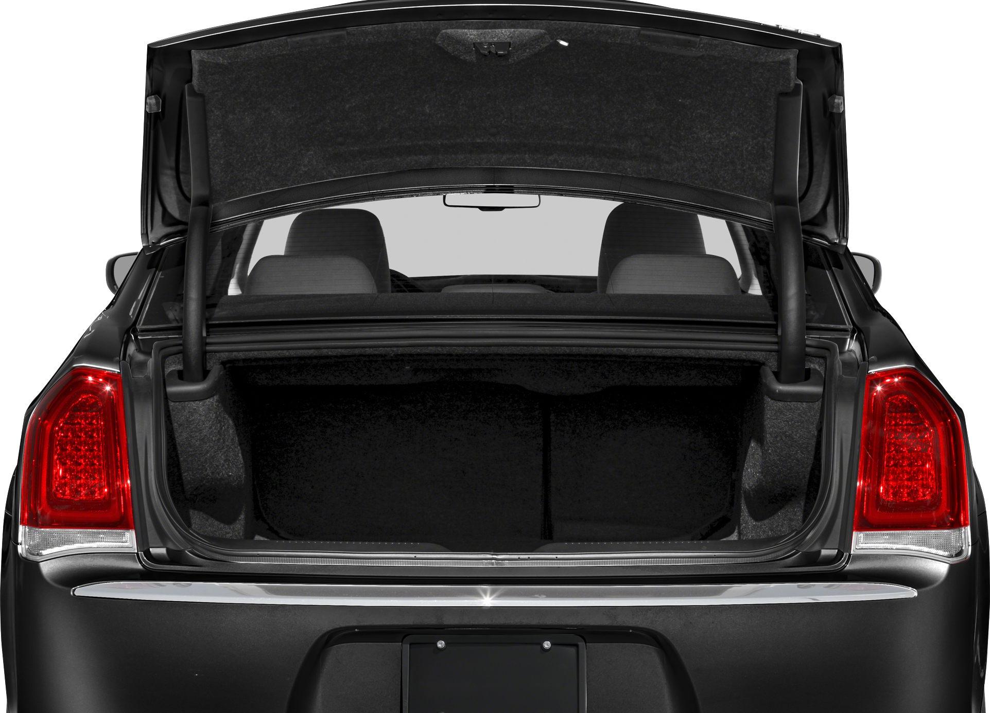 Open trunk and rear taillights of a sedan, showing spacious cargo area